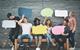 Group of young people holding speech bubbles